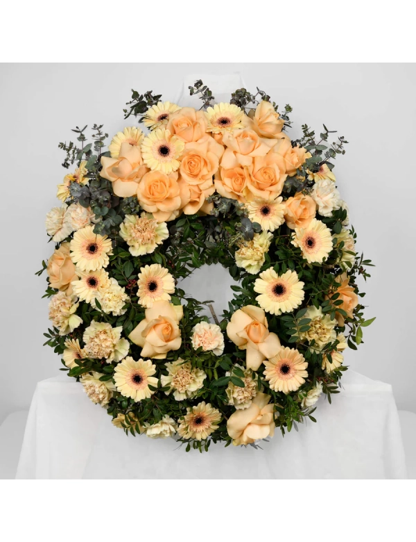 Coroana funerara cu gerbera si trandafiri somon 